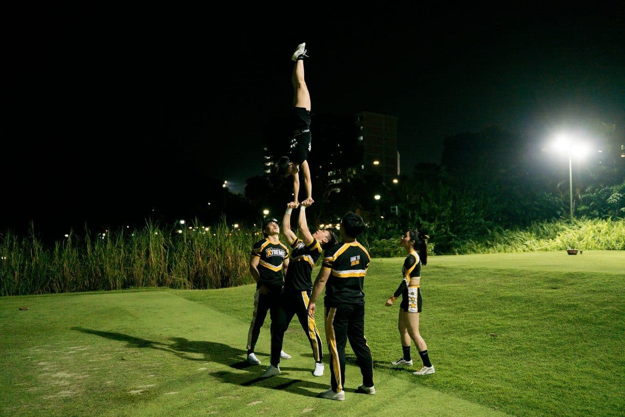 Performers under the lights at a night event