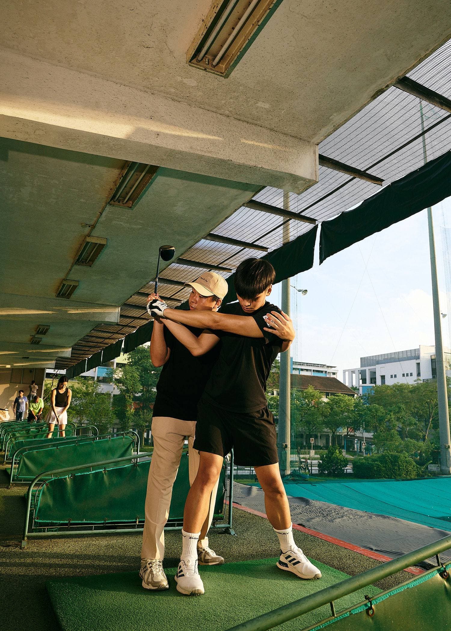An Avaday coach guiding a student through a swing